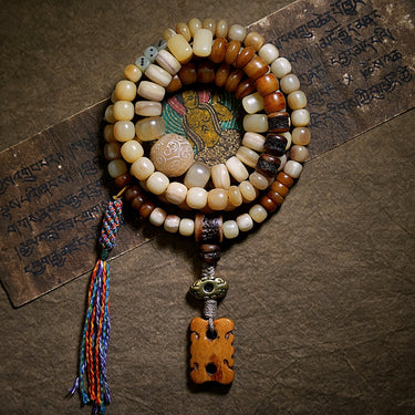 Carved bead and metal detail